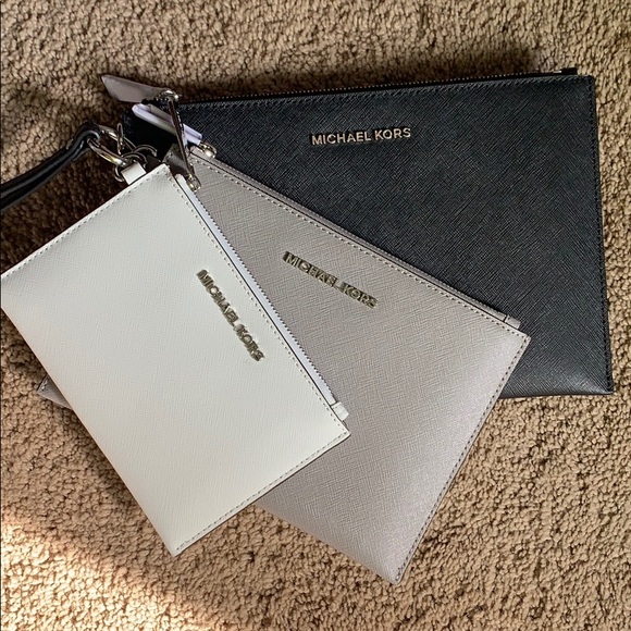 Michael Kors Handbags - Trio Michael Kors clutch